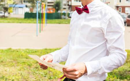 Man looking at city map on a trip. Looking for directionsの写真素材