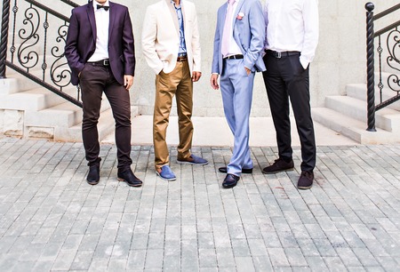 Groom With Best Man And Groomsmen At Wedding.