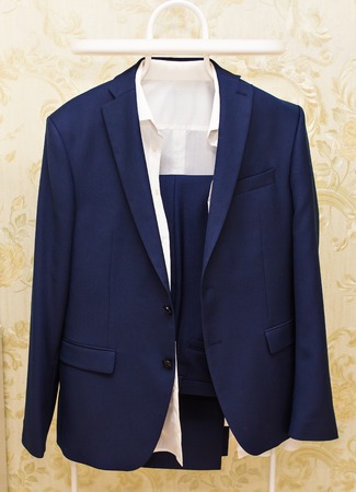 Formal suit in fashion concept. men's suit on the hangerの写真素材