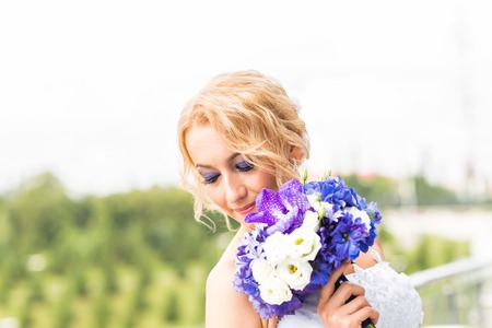 Beautiful wedding bouquet in hands of the bride.の写真素材