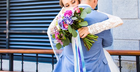 Wedding flowers ,Woman holding colorful bouquet with her hands on wedding day.の写真素材