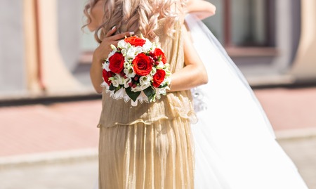 Beautiful wedding bouquet in hands of the bride.の写真素材