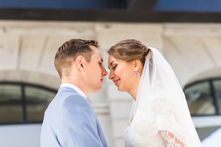 Bride and groom on their wedding day outdoors.の写真素材