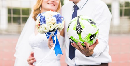 European Football Championship concept. Wedding couple on the football stadiumの写真素材