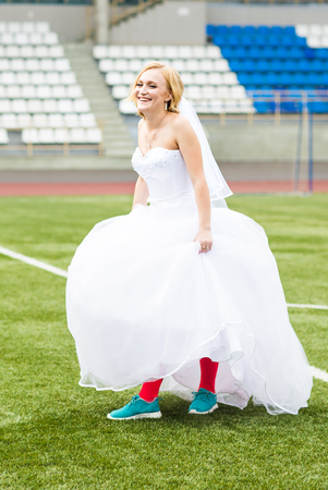 European Football Championship concept. Wedding couple on the football stadiumの写真素材