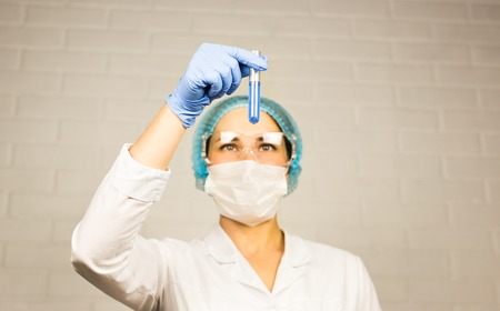 Scientist looking at test tube in the laboratory at the universityの写真素材