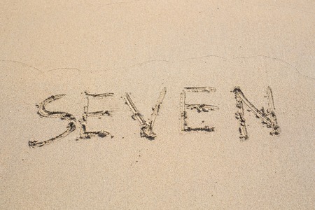Number seven on the Sand. Concept holiday backgroundの写真素材
