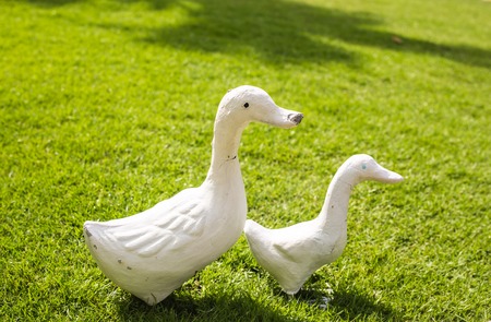 garden geese statues. Statues on the grassの写真素材