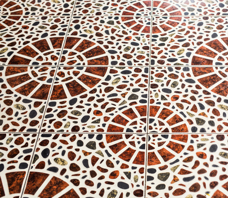 Brown marble-stone mosaic texture. Brown ceramic floor tiles closeup texture