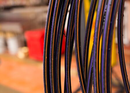 Messy electrical cables in thailand - Uncovered optical fiber technology open air outdoors in asian...