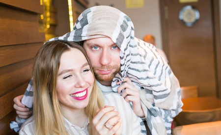 cheerful young couple fooling around. Nerds having funの写真素材