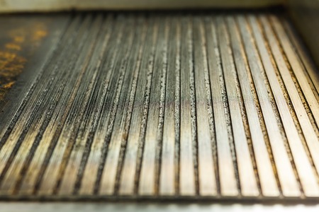 Close-up non stick grill pan. Texture and backgroundの写真素材