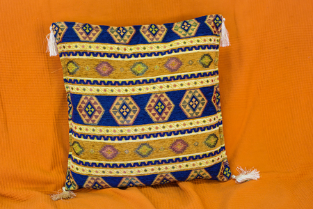 pillows with a Arabic pattern. pillow on orange couchの写真素材