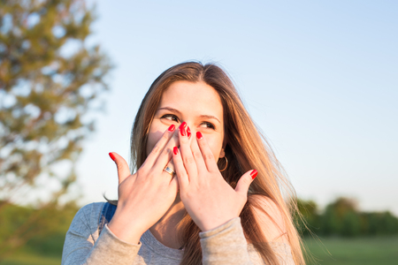 Beauty Sunshine Girl Portrait. Happy Woman Smiling. Sunny Summer Day under the Hot Sunの写真素材