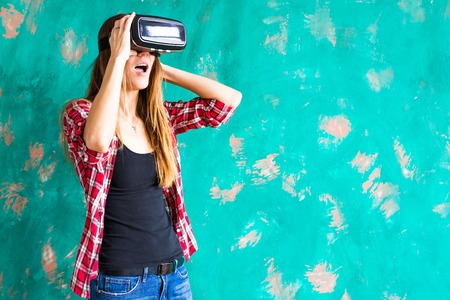 Smile happy woman getting experience using VR-headset glasses of virtual reality much gesticulating...
