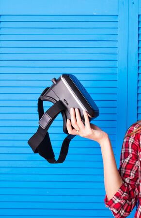 Woman wearing virtual reality goggless. Studio shotの写真素材