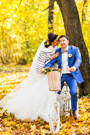 bride and groom in autumn park Love Life.の写真素材