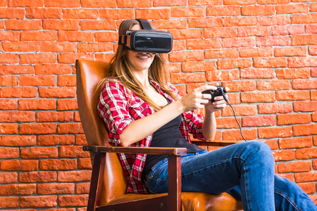 Woman play the video game with virtual reality device.の写真素材