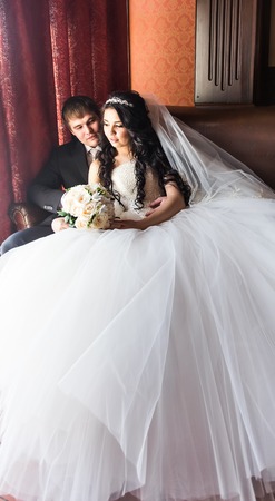 Happy bride and groom in vintage interior of resrourant.の写真素材