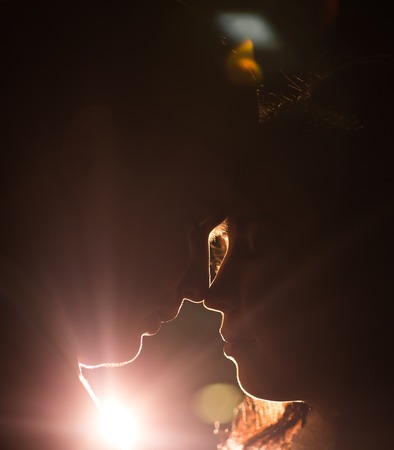 silhouette of a young couple in love, wedding and lovers concept.の写真素材