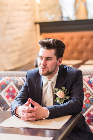 Businessman with a cup of coffee in the cafe.の写真素材