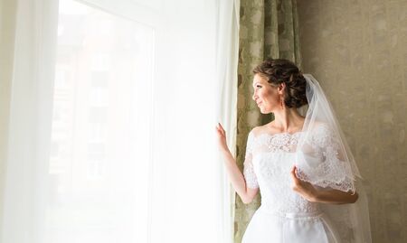 Portrait of a beautiful bride with wedding makeup.の写真素材