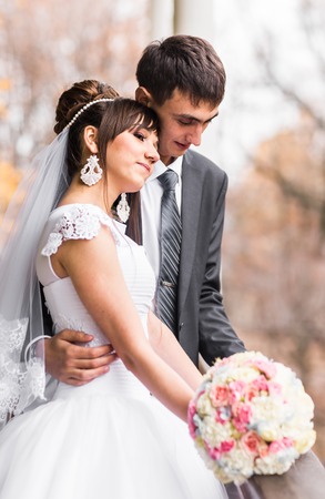 wedding couple at the winter snowy dayの写真素材