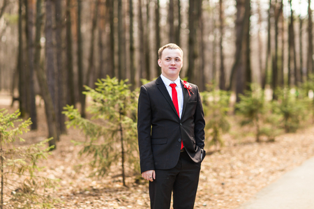 Handsome young man or groom, outdoors portraitの写真素材