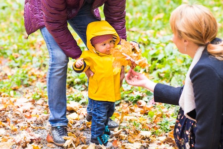 Father and son having fun outdoors on autumn nature.の写真素材