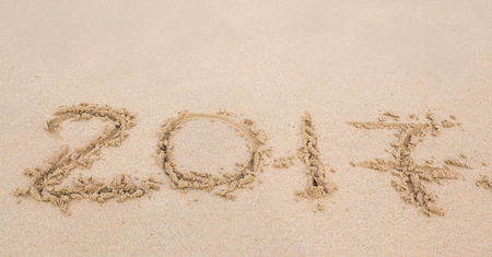 New Year 2017 is coming concept - inscription 2017 on a beach sand.の写真素材