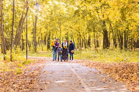 Family On Walk In Countryside in autumn natureの写真素材