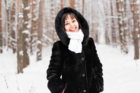 Attractive young pretty woman in wintertime outdoor.の写真素材