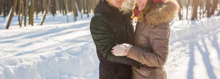 people, season, love and leisure concept - happy couple outdoors in winter.
