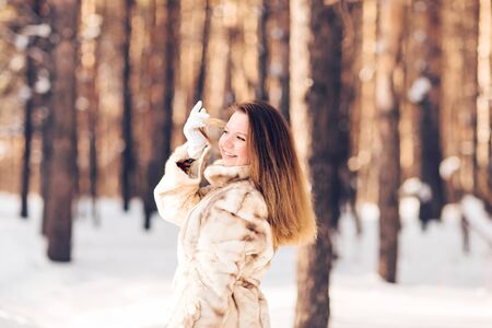 Young pretty Girl walking in snowy natureの写真素材