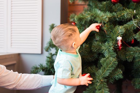 beautiful happy little boy with christmas ball.の写真素材