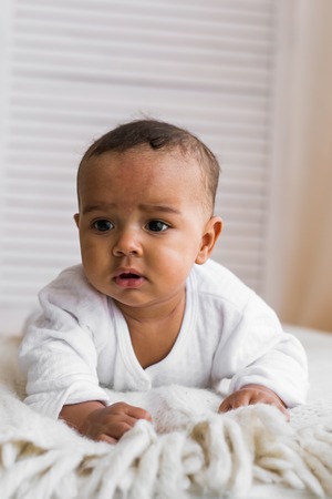 Adorable little african american baby boy looking - Black people.の写真素材