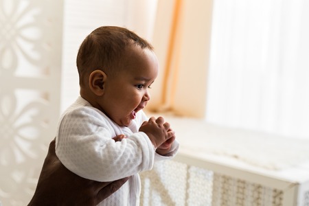 Happy African American Father Holding Baby sonの写真素材
