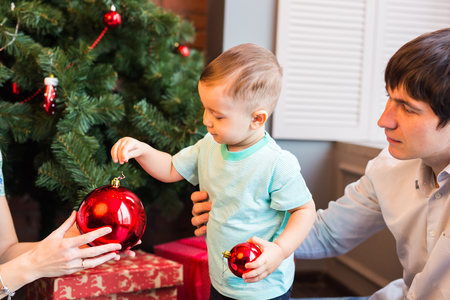 beautiful happy little boy with christmas balls.の写真素材