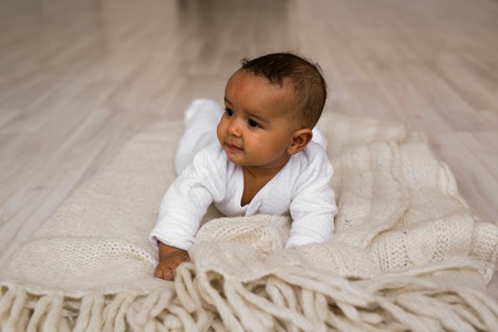 African American Baby Boy Lying Baby Boy Lying On Tummy At Homeの写真素材