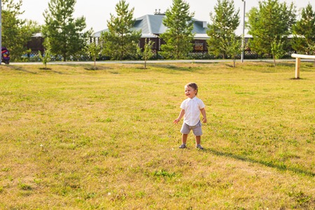 Baby Boy laughs on a sunny day.の写真素材