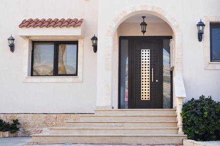 A front entrance of a home with a doorの写真素材