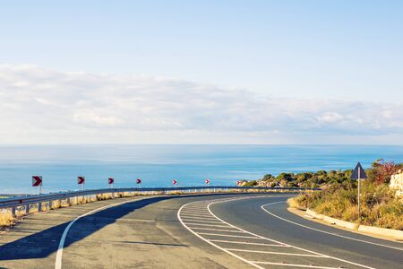 asphalt road and blue sky in summer dayの写真素材
