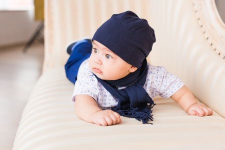 Portrait of cute baby boy wearing blue hat.の写真素材