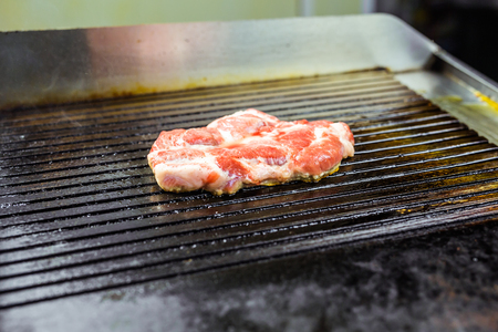 Grilled beef steak on the grill, close-up.の写真素材