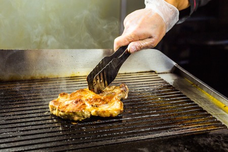 closeup of a steak on grillの写真素材