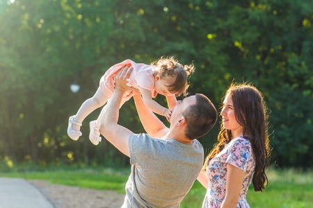 Happy Young Mixed Race Ethnic Family Walking Outdoorsの写真素材