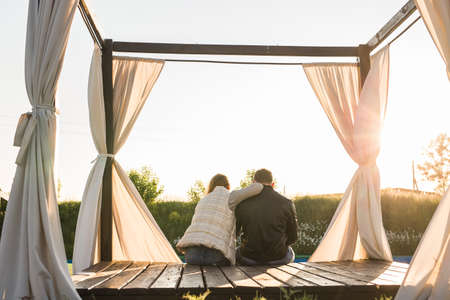 couple hugging in nature back viewの写真素材