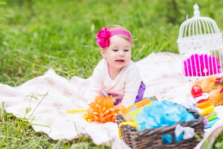 Adorable baby girl smile picnic playful weekend natureの写真素材