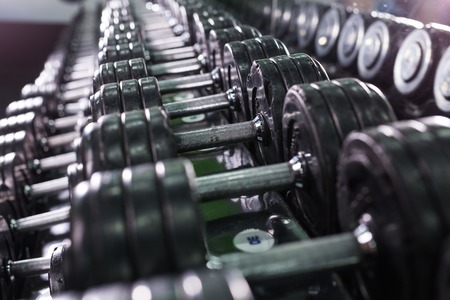 Rows of dumbbells in the gym close-upの写真素材