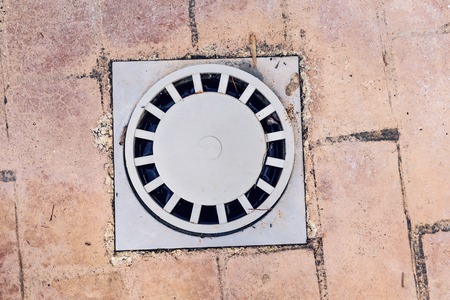 Manhole cover drainage system. Drainage near poolの写真素材